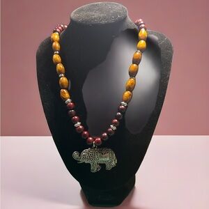 Artisan Elephant Pendant Necklace Brown
And tan wood